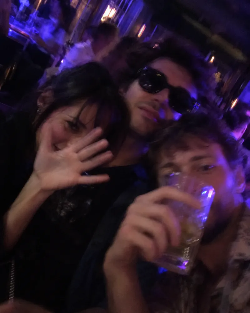 Bad photo for an AI rap video: dark, blurry group shot with sunglasses